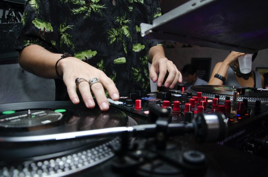 man playing dj band mixer